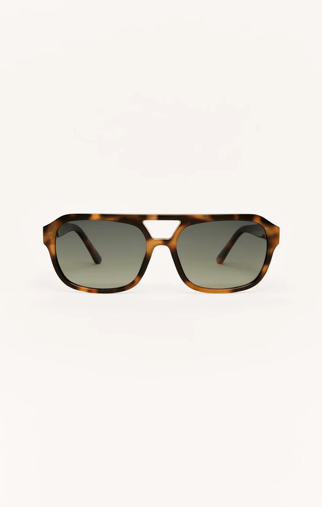 Sunglasses with tortoiseshell frame and dark lenses 