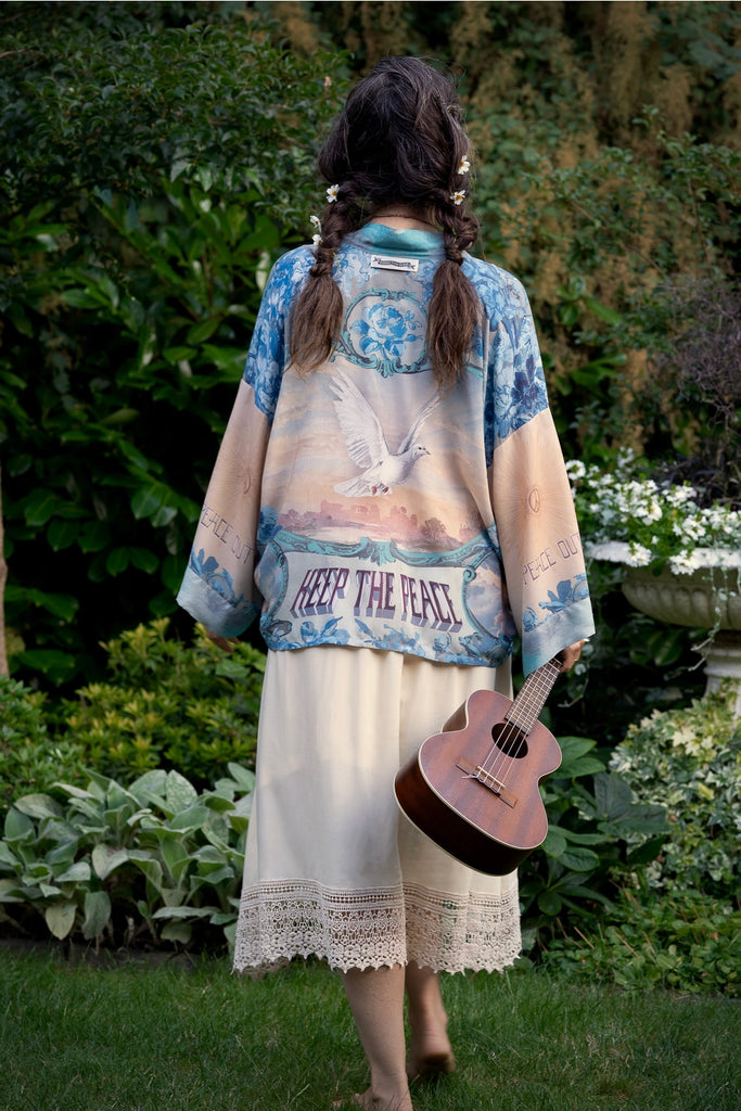 kimono with dove print and keep the peace words on the back